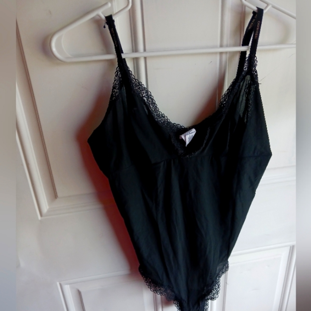 Ladies black Calvin Klein body suit slip, size L